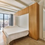 Meble do salonu z sypialnią. Jak ukryć łóżko w salonie?